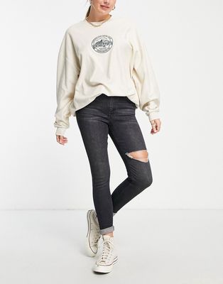 Topshop Jamie jeans with thigh rip jean in washed black