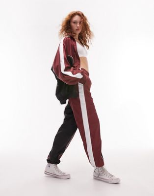 Topshop sporty shell cuffed tracksuit bottoms in burgundy - part of a set-Red