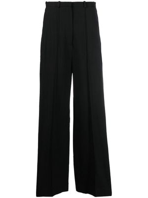 TOTEME high-waisted flared trousers - Black