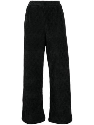 tout a coup checkerboard-knit high-waisted trousers - Black
