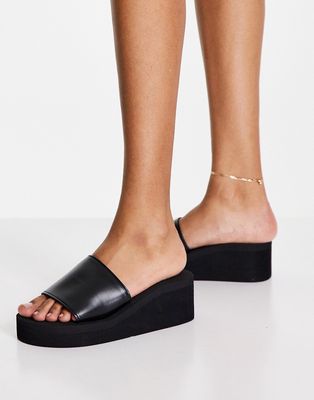 Truffle Collection casual heeled mules in black in black