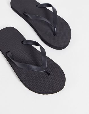 Truffle Collection flip flops in black