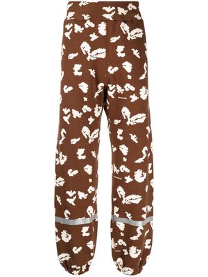 Undercover abstract-print track pants - Brown