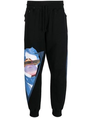 Undercover collage-print track pants - Black