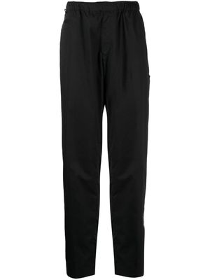 Undercover logo-patch elasticated-waistband trousers - Black