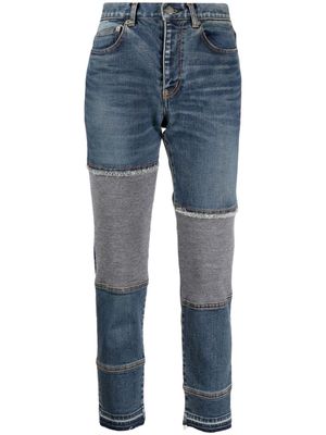 Undercover logo-patch panelled-design jeans - Blue