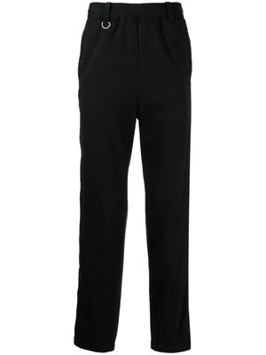 Undercover logo-patch straight-leg trousers - Black