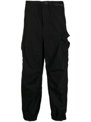 Undercover raw-cut tapered cargo trousers - Black