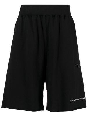 Undercover slogan-print cotton track shorts - Black