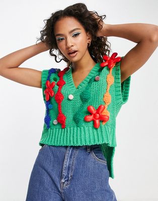 Urban Revivo knitted vest with swirl and pom poms detailing in green