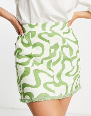 Urban Revivo mini skirt with fringe detail in green