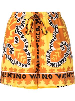 Valentino Garavani logo-print silk shorts - Orange