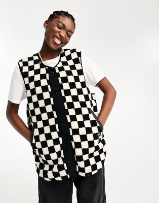 Vans reversible checkerboard print vest in black