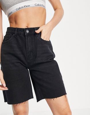 Vero Moda longline denim shorts with raw hem in black