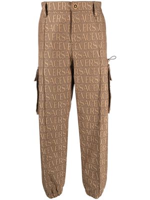 Versace Allover logo-print cargo trousers - Brown