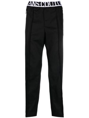 Versace Jeans Couture logo-waistband pleat-detail trousers - Black