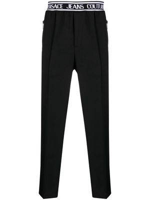 Versace Jeans Couture logo-waistband slim-cut trousers - Black