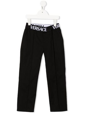 Versace Kids logo-waistband trousers - Black