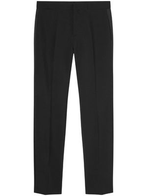 Versace logo--appliqué tapered chino trousers - Black