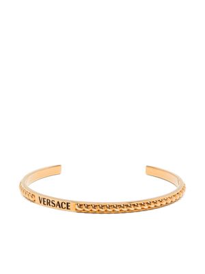 Versace logo-engraved embossed-detail bracelet - Gold