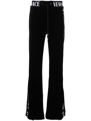 Versace logo-lettering trousers - Black