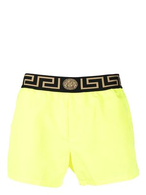 Versace logo-waistband swim shorts - Yellow