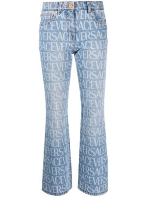 Versace mid-rise logo-print bootcut jeans - Blue