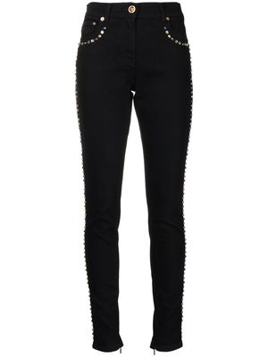 Versace studded slim-cut jeans - Black