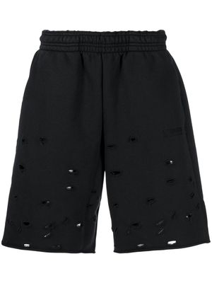 VETEMENTS above-knee ripped track shorts - Black