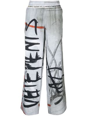VETEMENTS Graffiti logo-print track pants - Grey