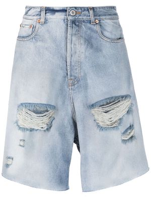 VETEMENTS ripped-detailed denim shorts - Blue
