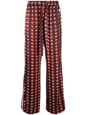 Wales Bonner Snare all-over print trousers - Brown