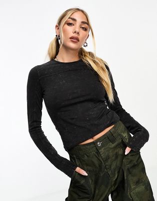 Weekday Pace long sleeve top with exposed seams in acid wash black