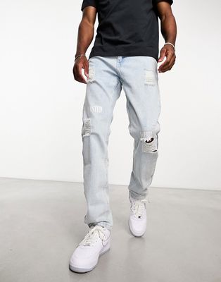 WESC Teddy slim tapered jeans with rips in light blue