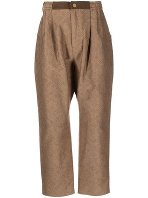 White Mountaineering geometric-print tapered trousers - Brown
