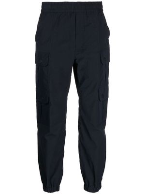 White Mountaineering multiple-pockets elasticated band pant - Blue