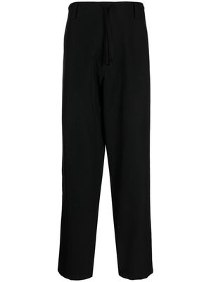 Yohji Yamamoto logo-appliqué wool trousers - Black