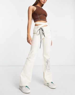 Zemeta low waist pants in ecru with corset cross waist detail-White